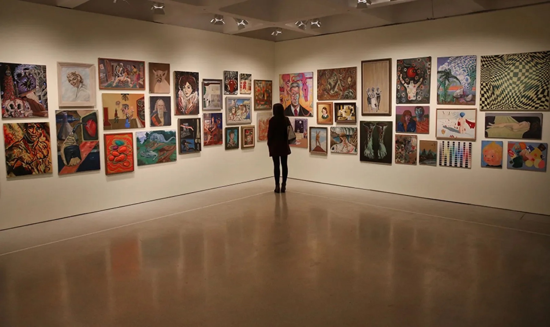 A curated gallery wall of framed artwork